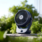 Airzentti Portable fan on a stone surface with greenery in the background